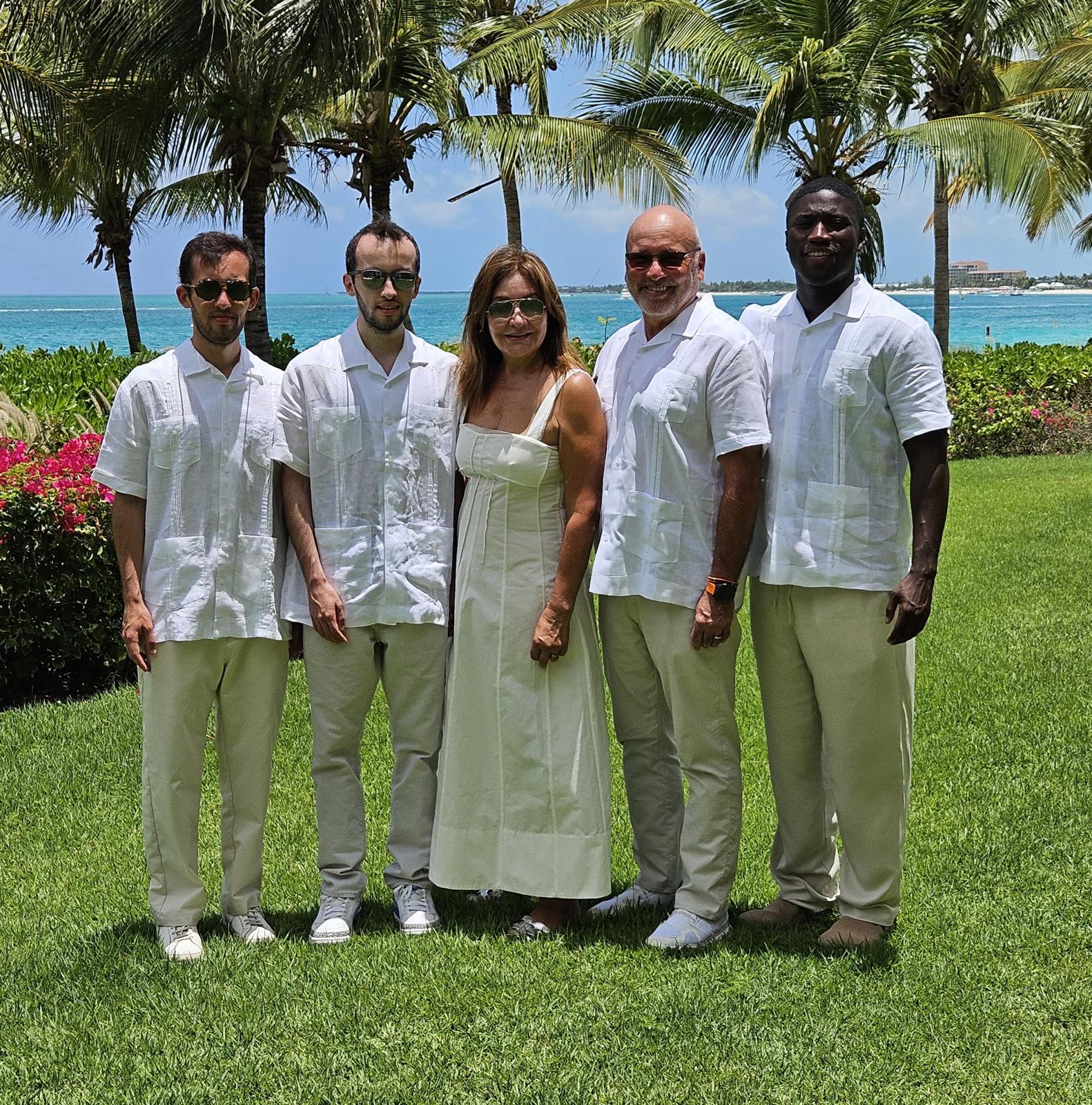 Aixa and Thomas with family in a tropical setting